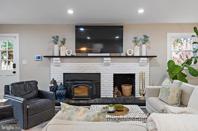 a bathroom with double sink and a mirror