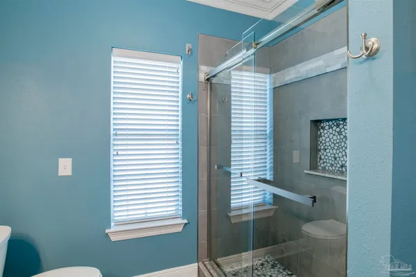 a bathroom with a toilet and a sink