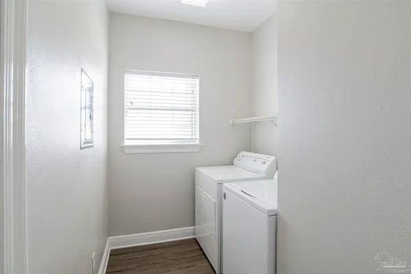 a view of a room that has a washer and dryer