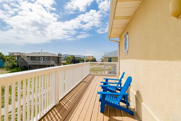 a view of balcony with furniture