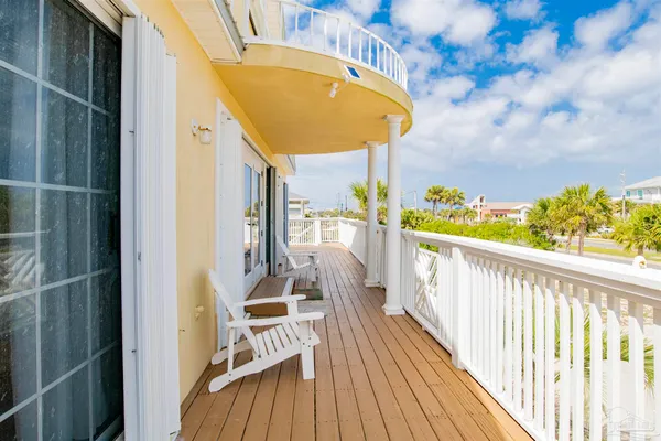 a view of balcony with furniture