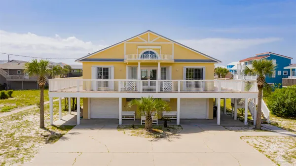 a front view of house with outdoor seating