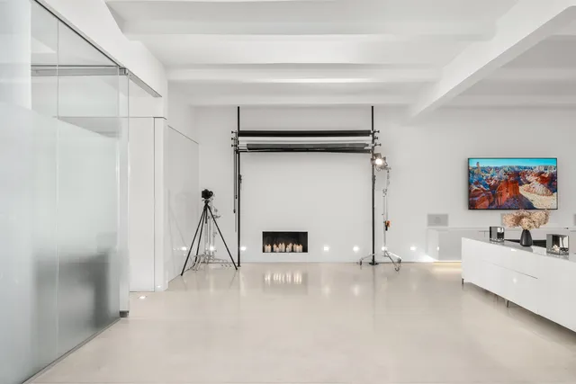 a living room with furniture and a rug