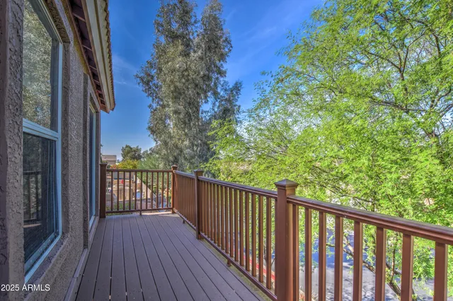 a view of a balcony with wooden floor