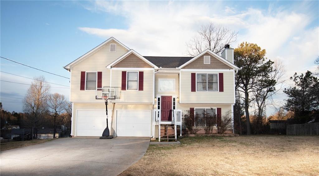 166 Wesley Chapel Road Villa Rica, GA 30180 - Photo 1 of 1 a view of a house with a yard and large trees