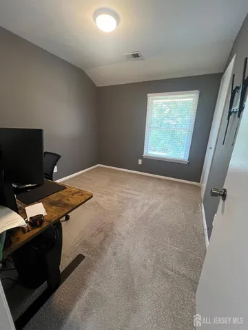 a workspace with furniture and window