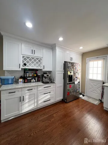 a kitchen with stainless steel appliances a stove and refrigerator