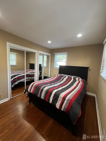 a bedroom with a bed and a walk in closet