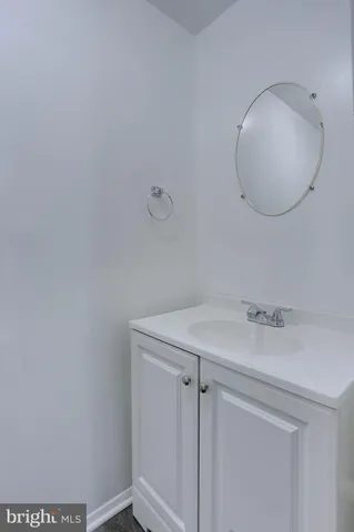 a bathroom with a sink and vanity