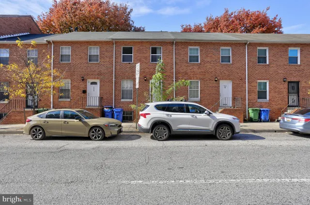 a view of car parked in front of a house