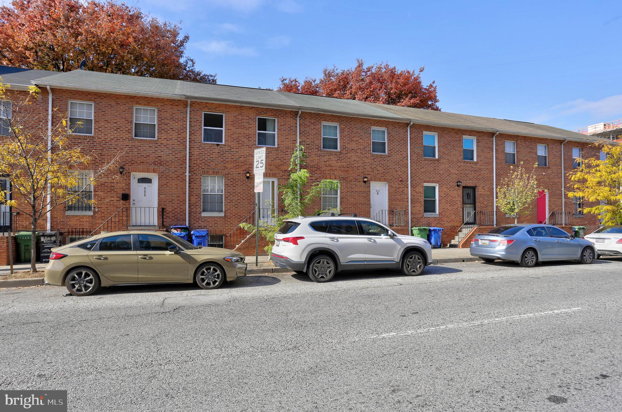 410 South Washington Street Baltimore, MD 21231 - Photo 22 of 29 a view of cars parked in front of a house