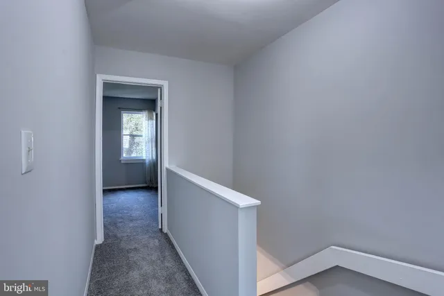 a view of hallway with closet