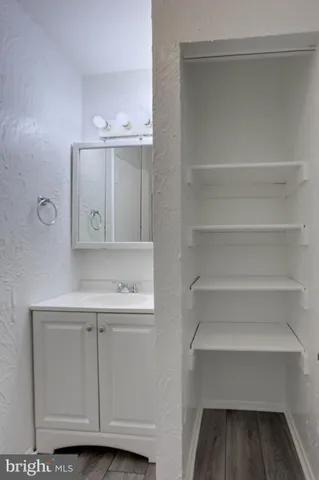 a view of cabinets and utility room with washer dryer