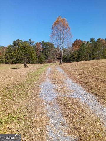 a view of an outdoor space and trees all around