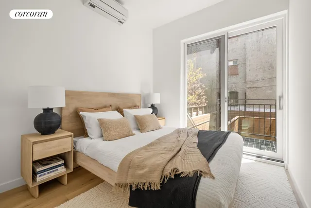 a kitchen with stainless steel appliances granite countertop a dining table chairs and white cabinets
