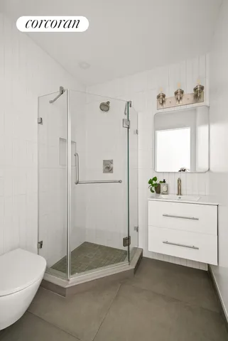 a bedroom with a bed and glass door