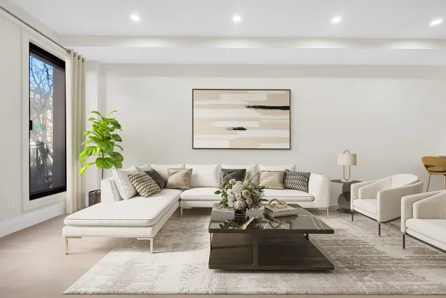 a living room with furniture and a potted plant
