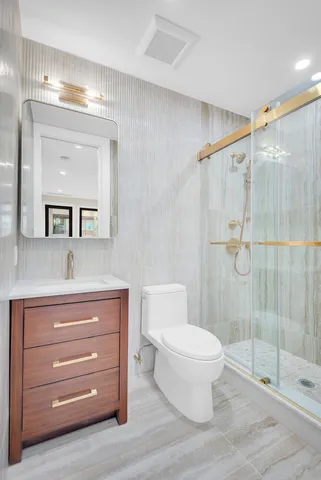 a bedroom with bed and a potted plant