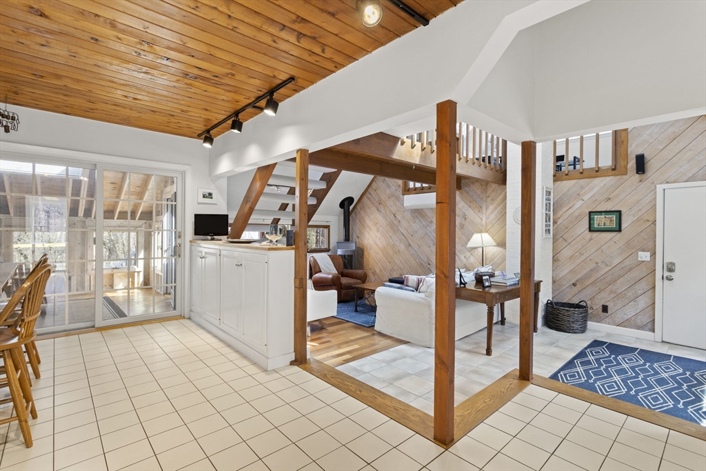 92 Middleton Road Boxford, MA 01921 - Photo 13 of 42 a view of a hallway with dining area and chandelier