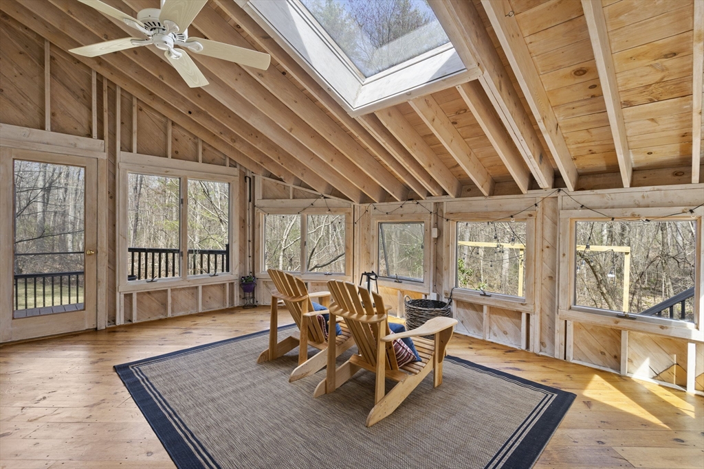 92 Middleton Road Boxford, MA 01921 - Photo 14 of 42 a dining room with wooden floor and large windows
