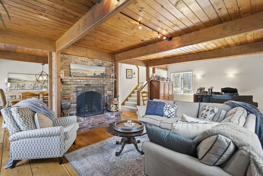 92 Middleton Road Boxford, MA 01921 - Photo 16 of 42 a living room with furniture and a fireplace
