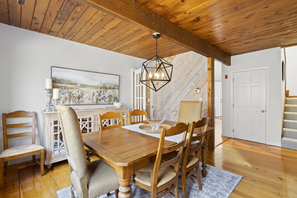 92 Middleton Road Boxford, MA 01921 - Photo 19 of 42 a dining room with furniture and wooden floor