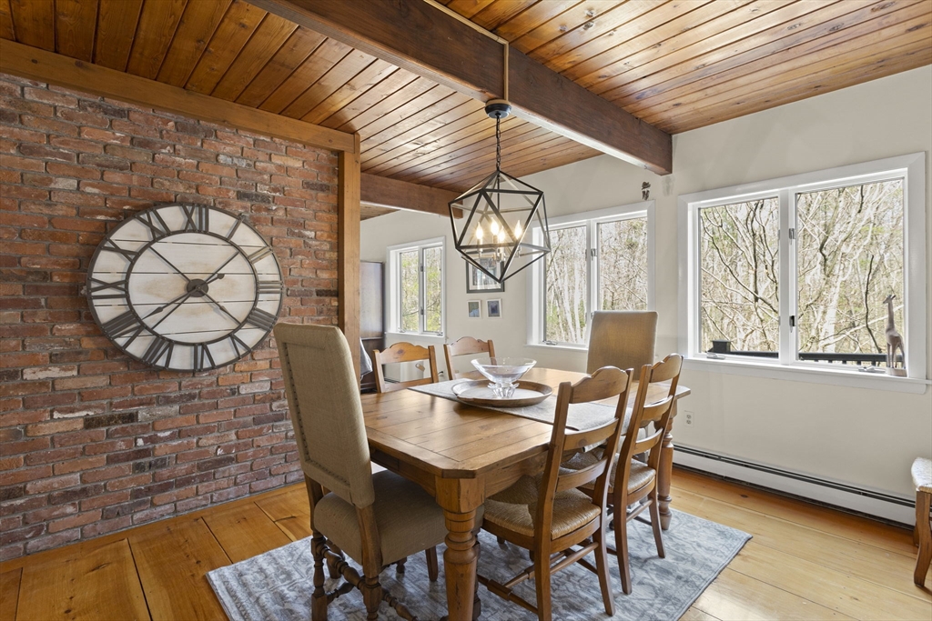 92 Middleton Road Boxford, MA 01921 - Photo 20 of 42 a view of a dining room with furniture and wooden floor