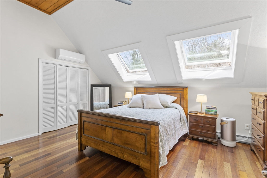 92 Middleton Road Boxford, MA 01921 - Photo 24 of 42 a bedroom with a bed and wooden floor