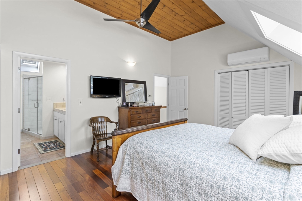 92 Middleton Road Boxford, MA 01921 - Photo 25 of 42 a bedroom with a bed and a flat screen tv