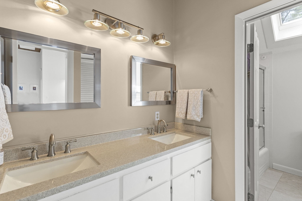 92 Middleton Road Boxford, MA 01921 - Photo 30 of 42 a bathroom with a sink vanity granite and a mirror