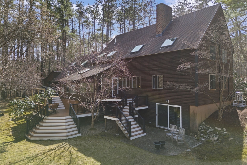 92 Middleton Road Boxford, MA 01921 - Photo 3 of 42 a front view of a house with a yard