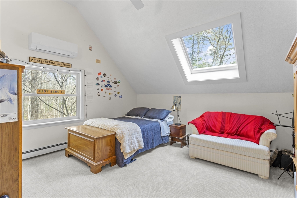 92 Middleton Road Boxford, MA 01921 - Photo 33 of 42 a spacious bedroom with a bed and a couch