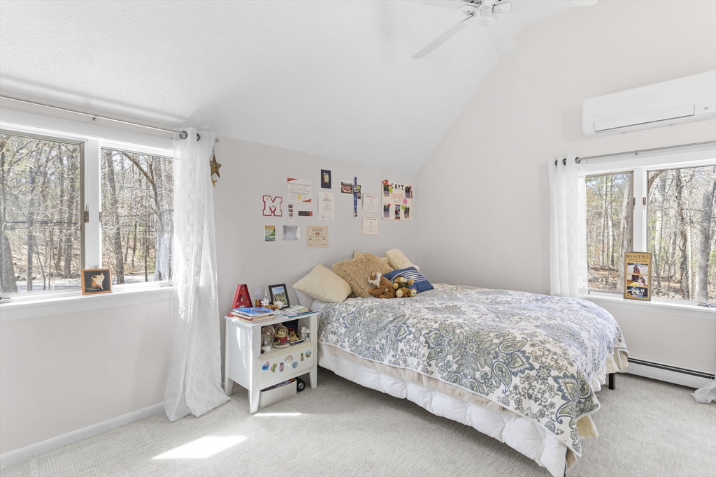 92 Middleton Road Boxford, MA 01921 - Photo 35 of 42 a bedroom with a bed and a large window with the outer view