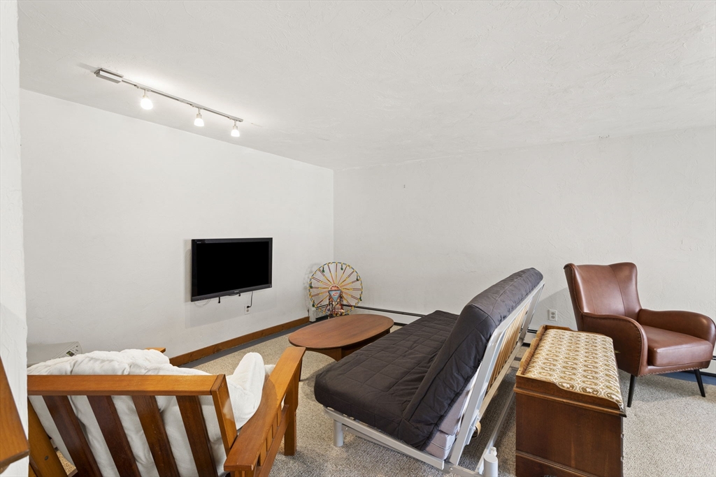 92 Middleton Road Boxford, MA 01921 - Photo 38 of 42 a bedroom with furniture and a flat screen tv