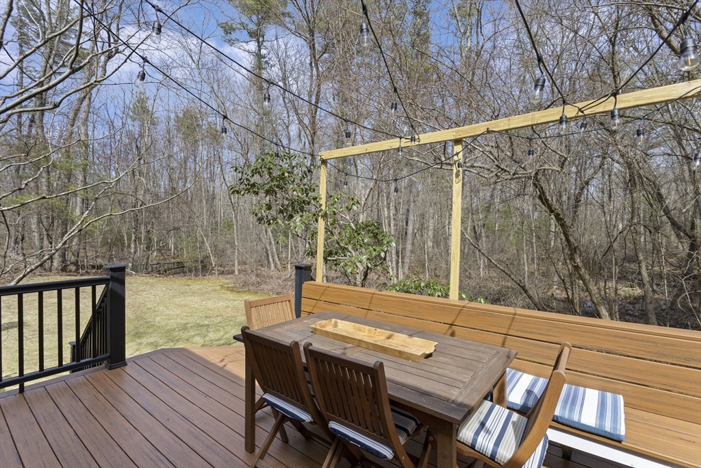 92 Middleton Road Boxford, MA 01921 - Photo 4 of 42 a backyard of a house with wooden floor and outdoor seating