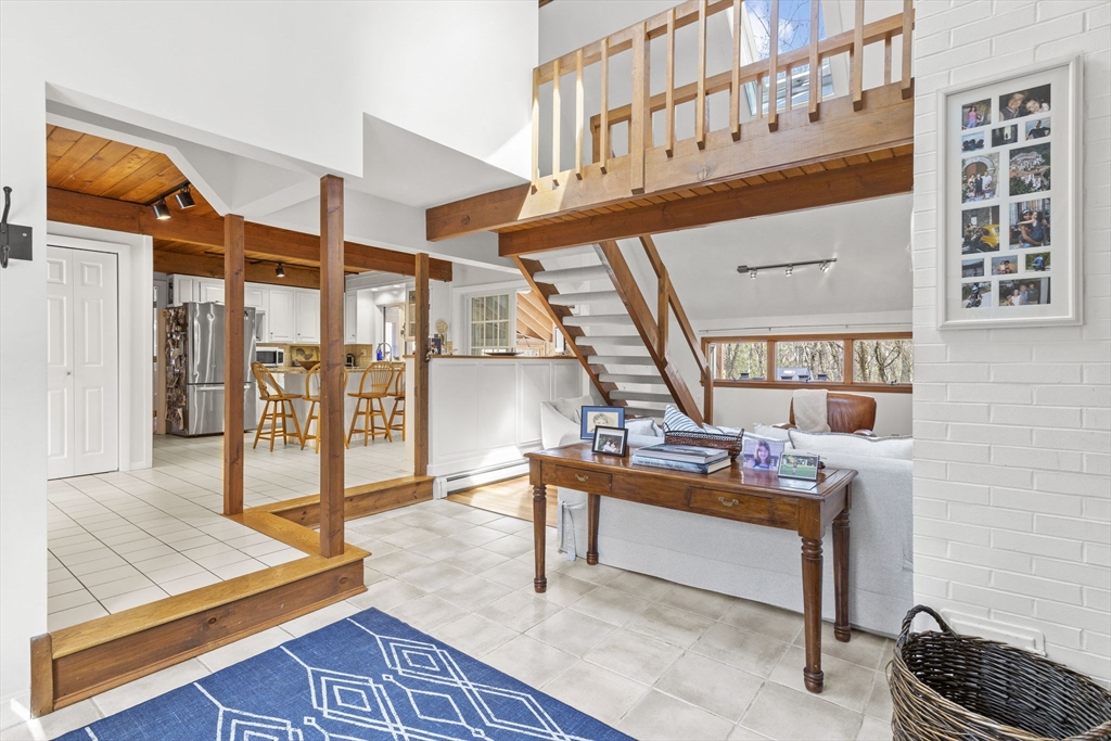 92 Middleton Road Boxford, MA 01921 - Photo 7 of 42 a living room with furniture a rug and a window