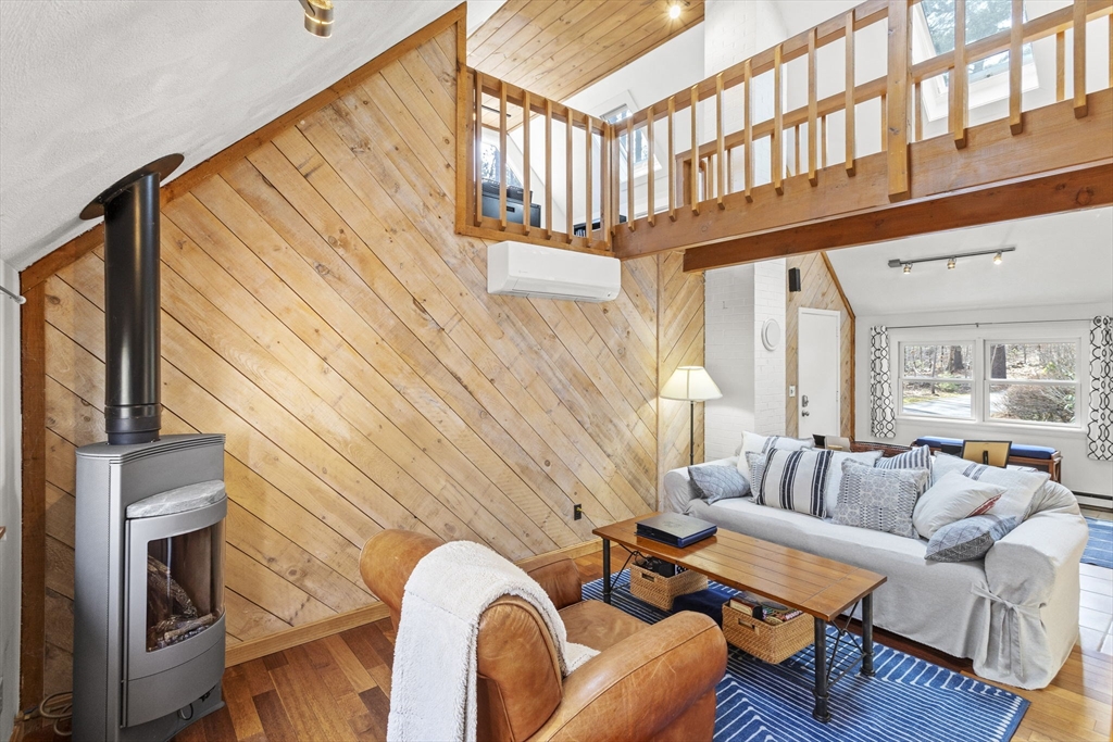 92 Middleton Road Boxford, MA 01921 - Photo 9 of 42 a living room with furniture a rug and a floor to ceiling window