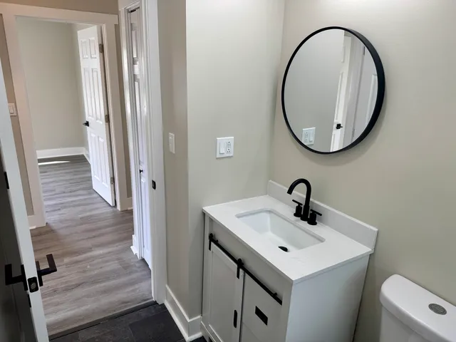 a bathroom with a sink and a mirror