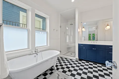 a bathroom with a sink vanity and a mirror