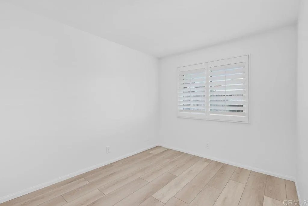 889 Bracero Road Encinitas, CA 92024 - Photo 18 of 59 an empty room with a white cabinet