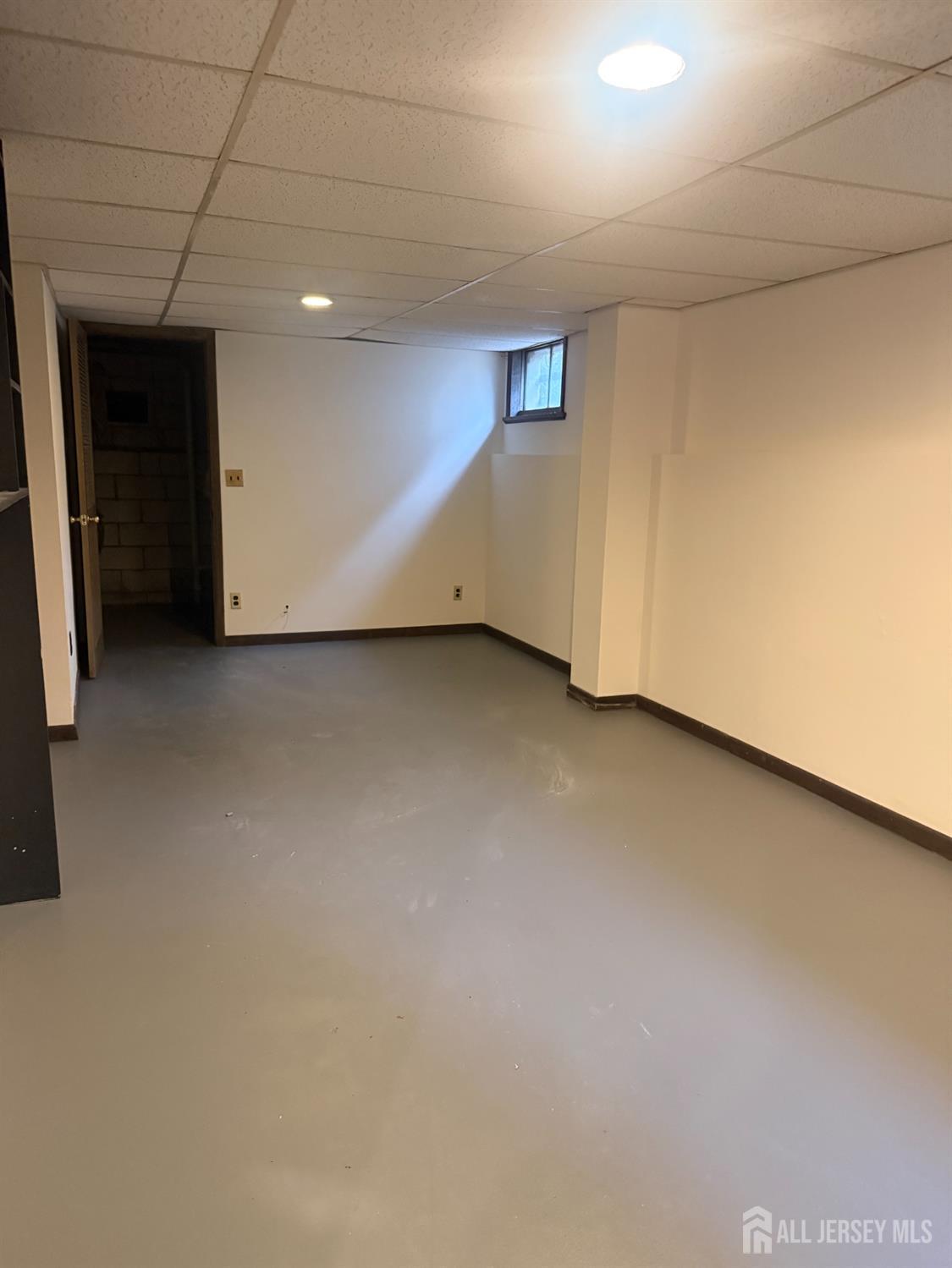 710-712 Drake Avenue, Unit 710 Middlesex, NJ 08846 - Photo 15 of 25 wooden floor in an empty room with a window
