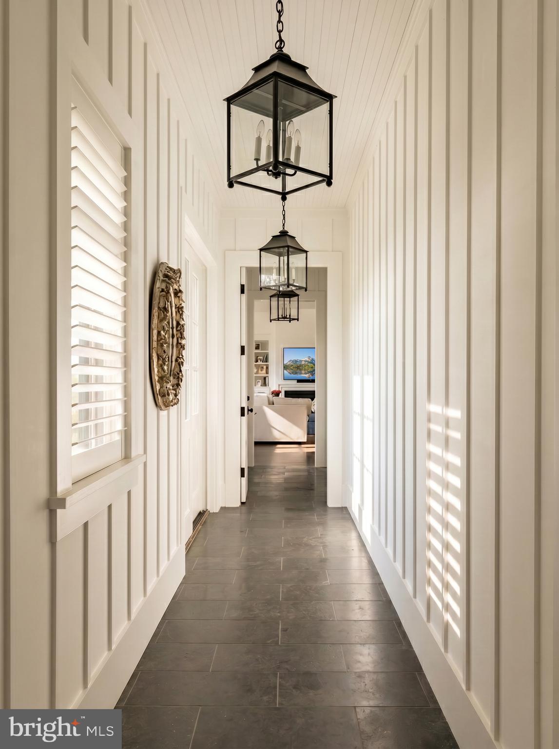 7316 Old Carters Mill Road The Plains, VA 20198 - Photo 31 of 50 a view of a hallway with a window and chandelier