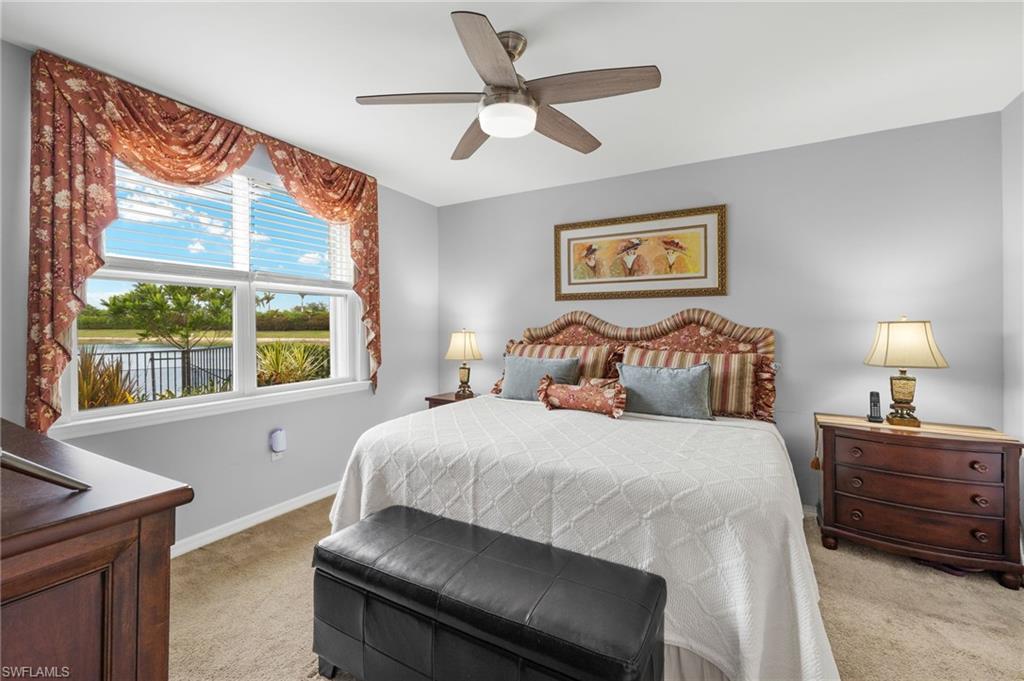 14615 Edgewater Circle Naples, FL 34114 - Photo 13 of 42 a bedroom with a bed and a large window