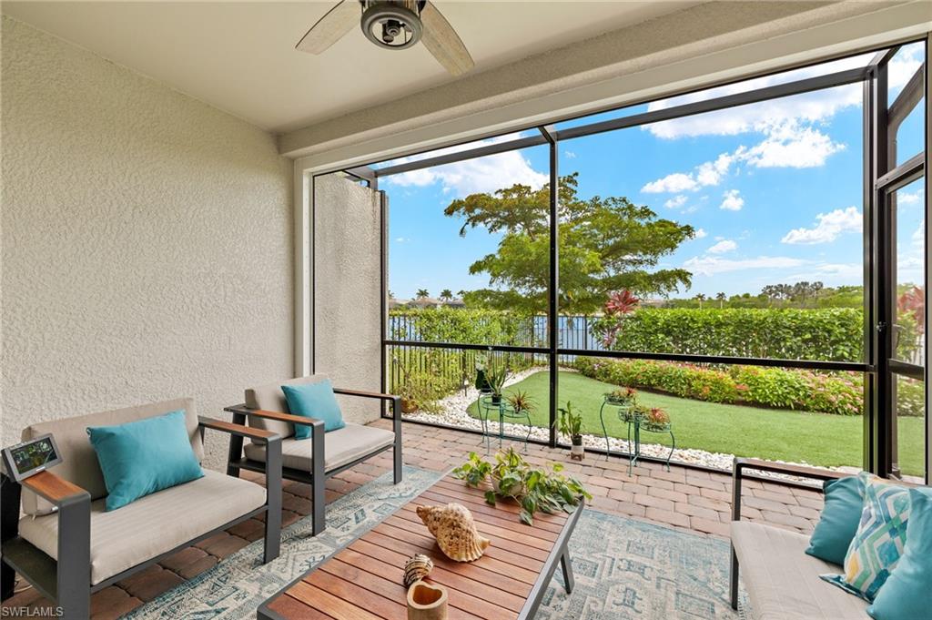 14615 Edgewater Circle Naples, FL 34114 - Photo 21 of 42 a view of a living room and a floor to ceiling window