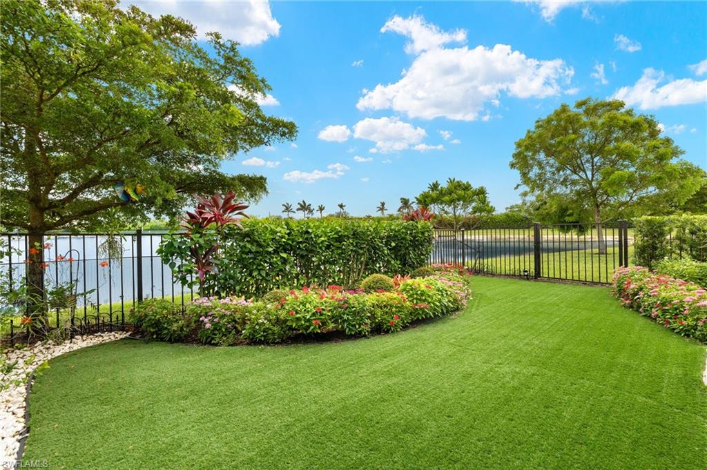 14615 Edgewater Circle Naples, FL 34114 - Photo 23 of 42 a view of a garden with a slide in the back
