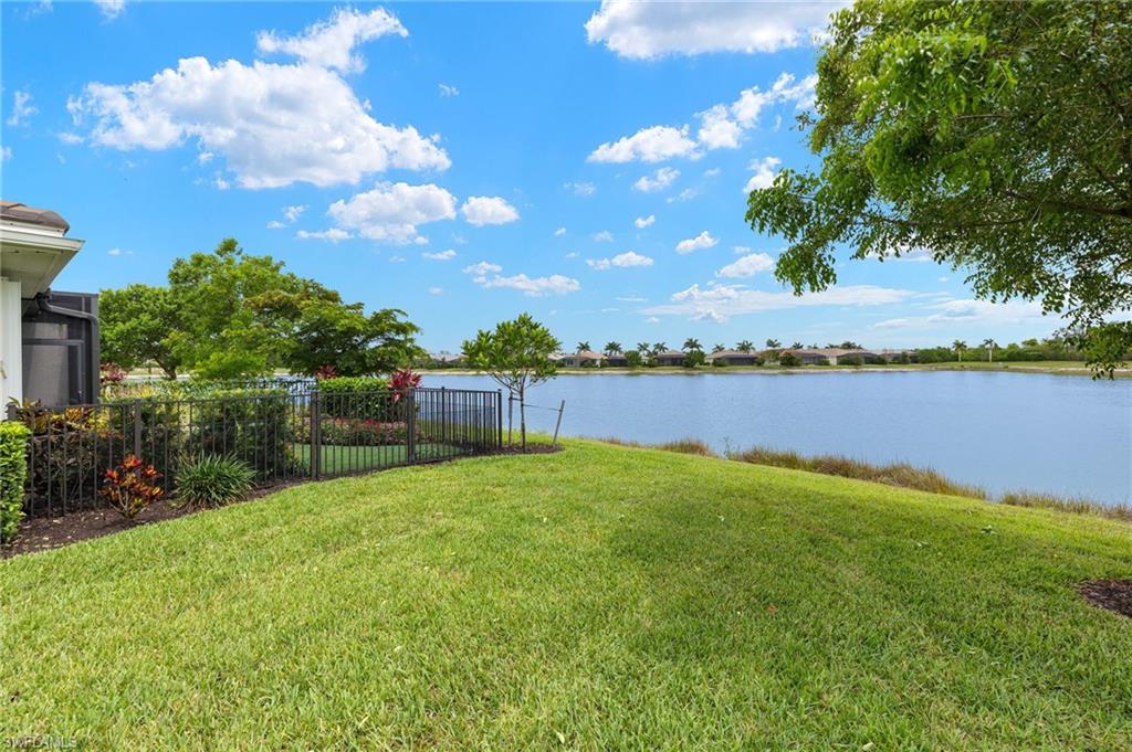 14615 Edgewater Circle Naples, FL 34114 - Photo 25 of 42 a view of a garden with houses