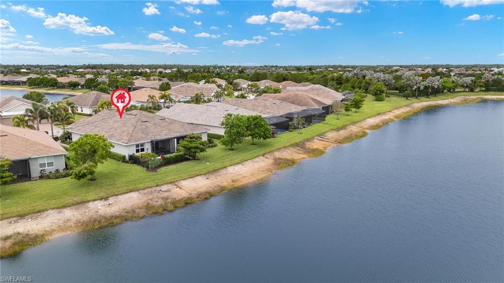 14615 Edgewater Circle Naples, FL 34114 - Photo 30 of 42 an aerial view of a house with a lake view