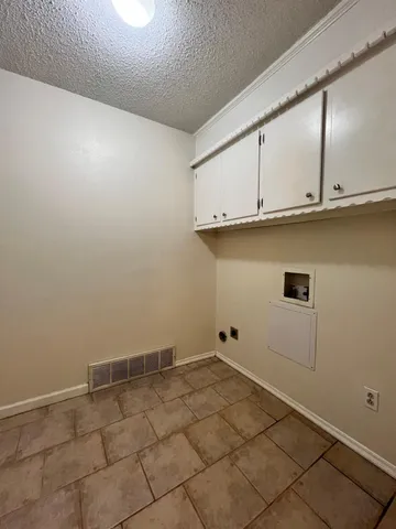 a view of room with cabinets