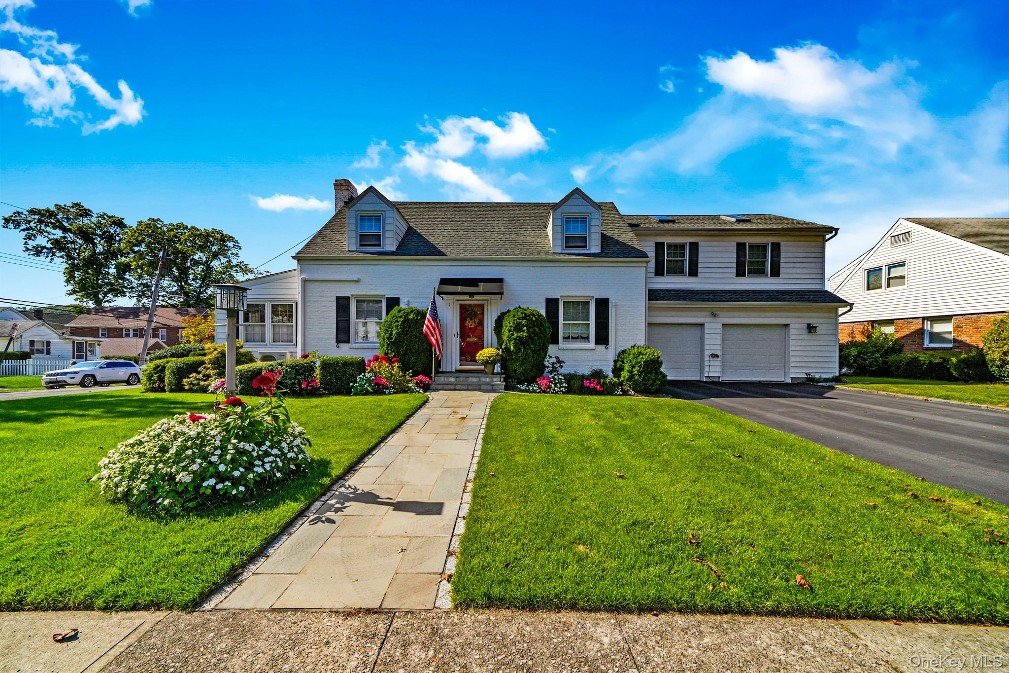 1 Hoover Road Yonkers, NY 10710 - Photo 1 of 50 a front view of a house with a yard and potted plants