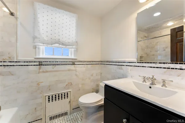 a bathroom with a sink and a toilet